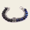Bracelet with black and blue beads on a white background
