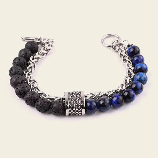 Bracelet with black and blue beads on a white background