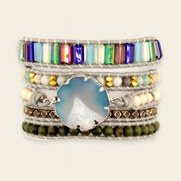 Stack of colorful beaded bracelets on a light background