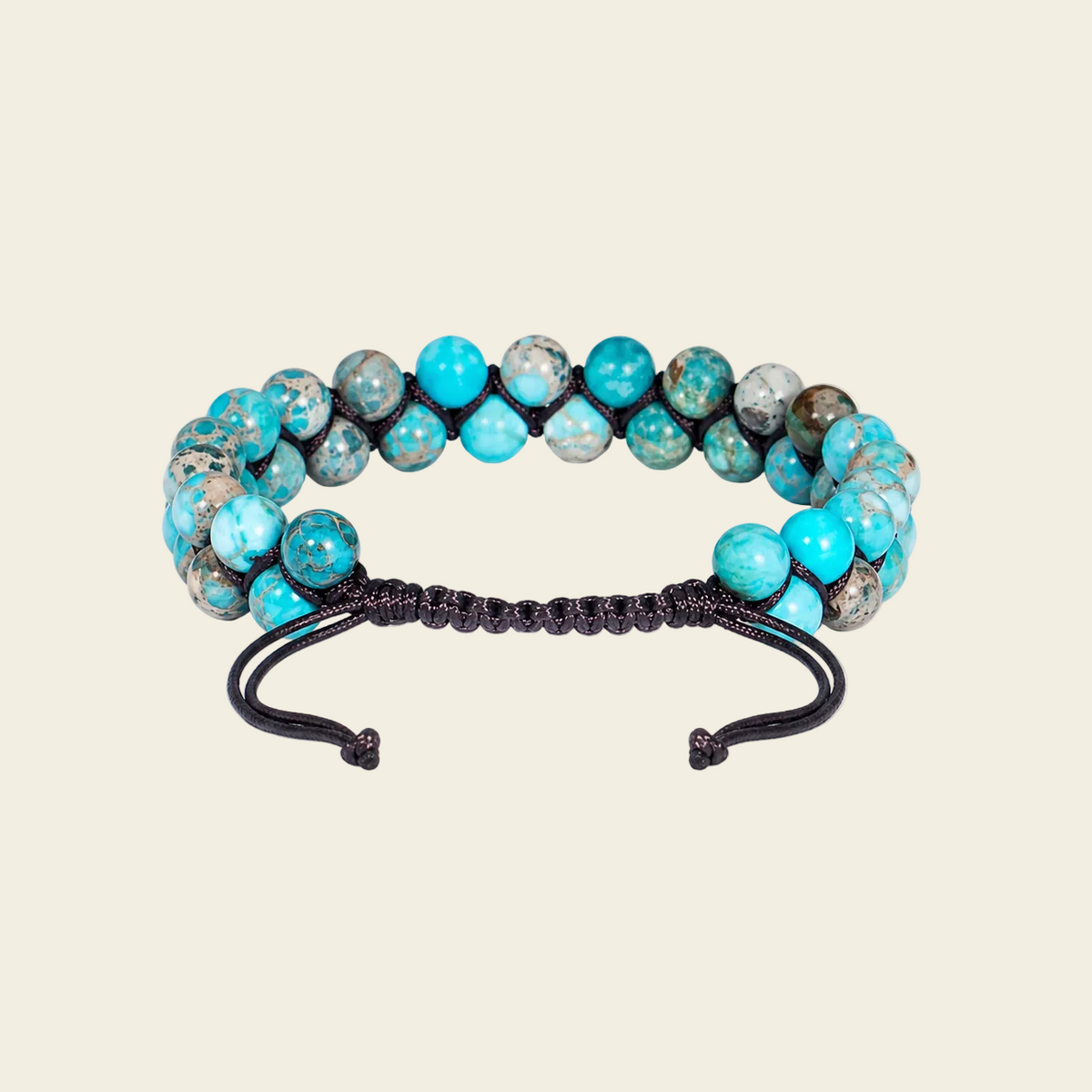 Turquoise and gray beaded bracelet on a beige background