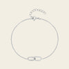 Silver bracelet on a light beige background