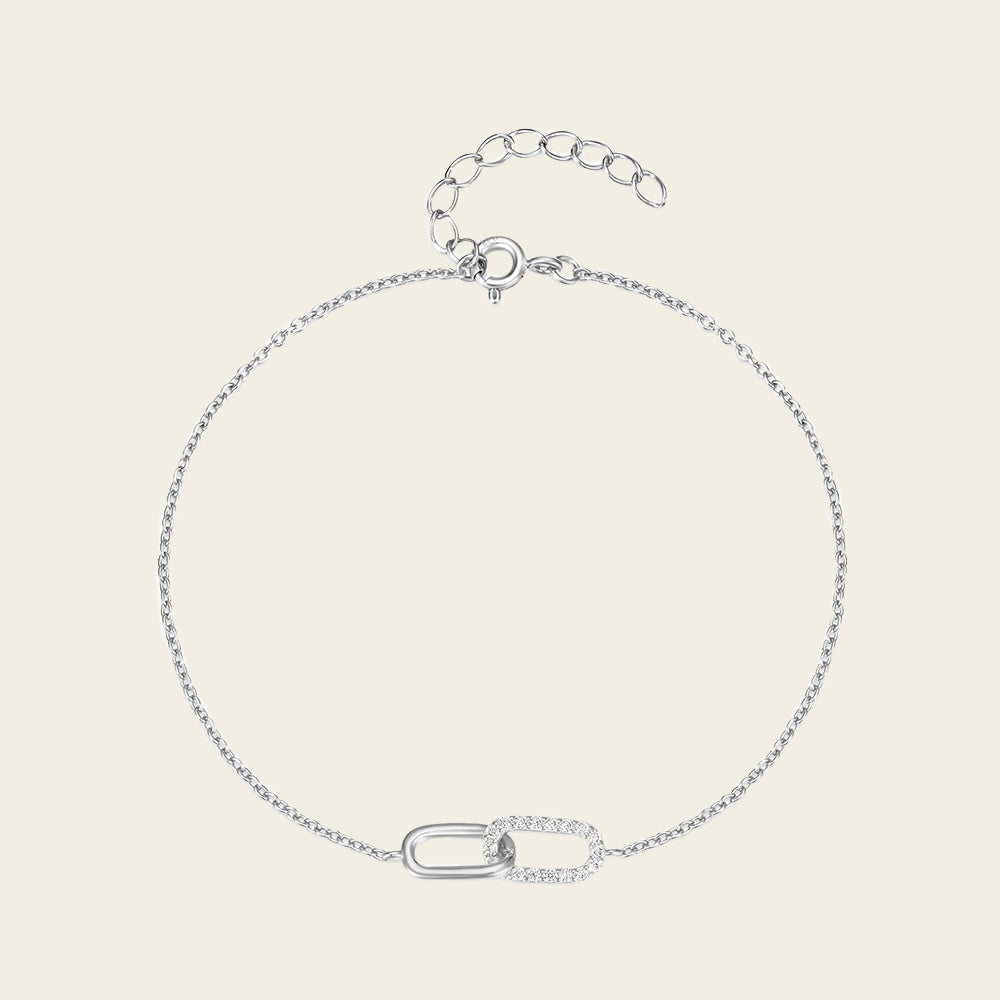 Silver bracelet on a light beige background