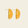 A pair of gold-toned semi-circular dome earrings with a textured inner edge and post backs, shown on a light cream background.