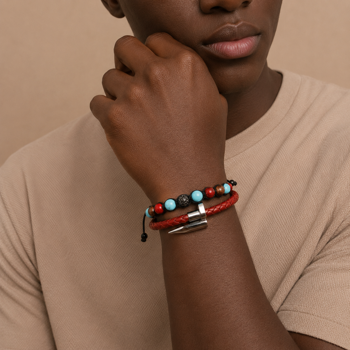 Person wearing a bracelet with beads on a beige background