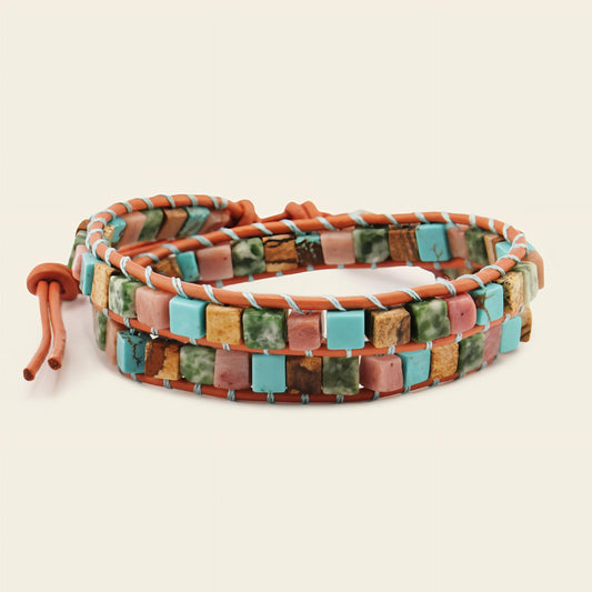 Multicolored beaded bracelet on a beige background