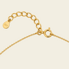 Gold chain Clasp with a clasp on a beige background