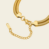 Close-up of a gold snake-chain necklace with a lobster clasp, heart-shaped connector and extender chain.