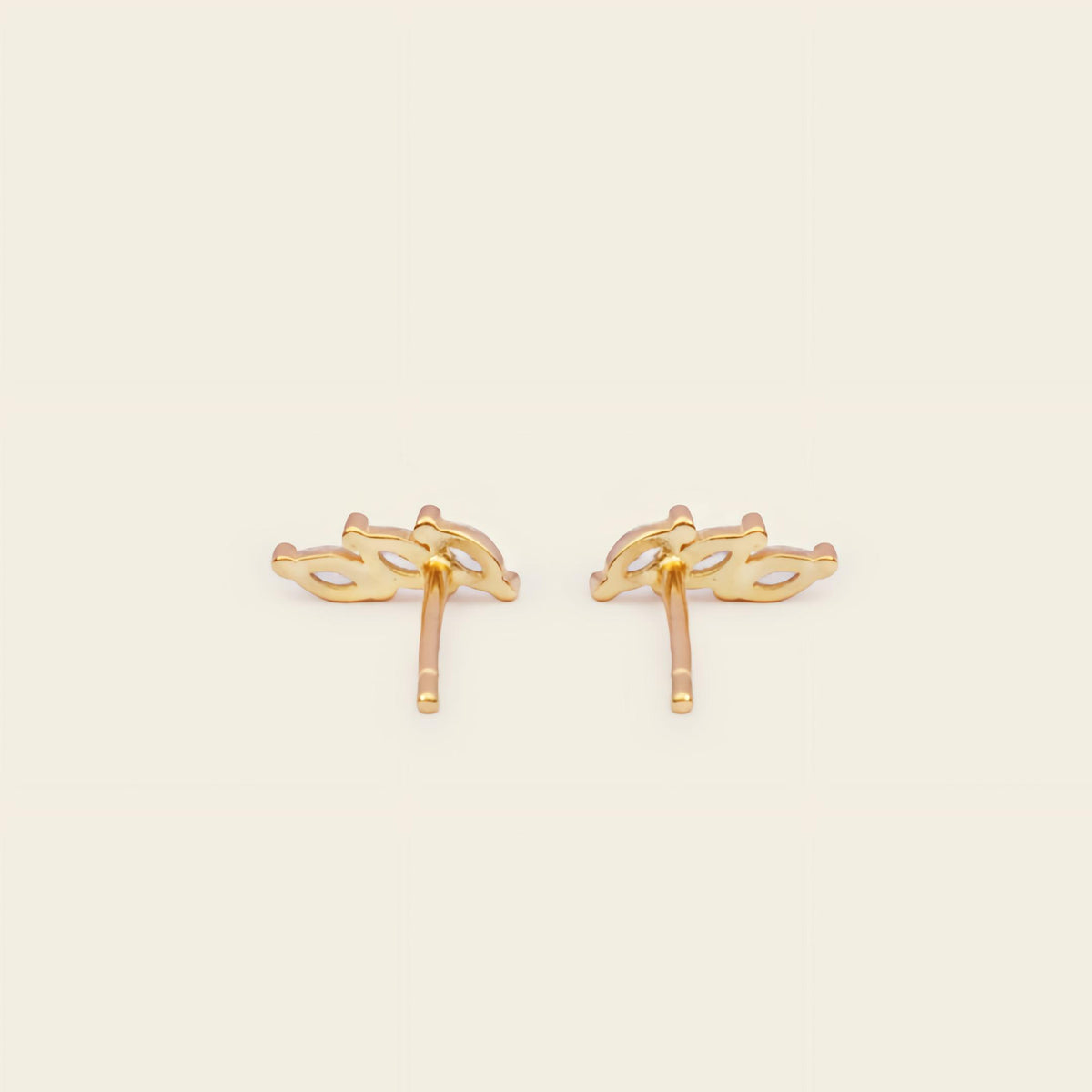Gold ring with embedded diamonds on a white background