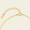 Gold Clasp on a beige background