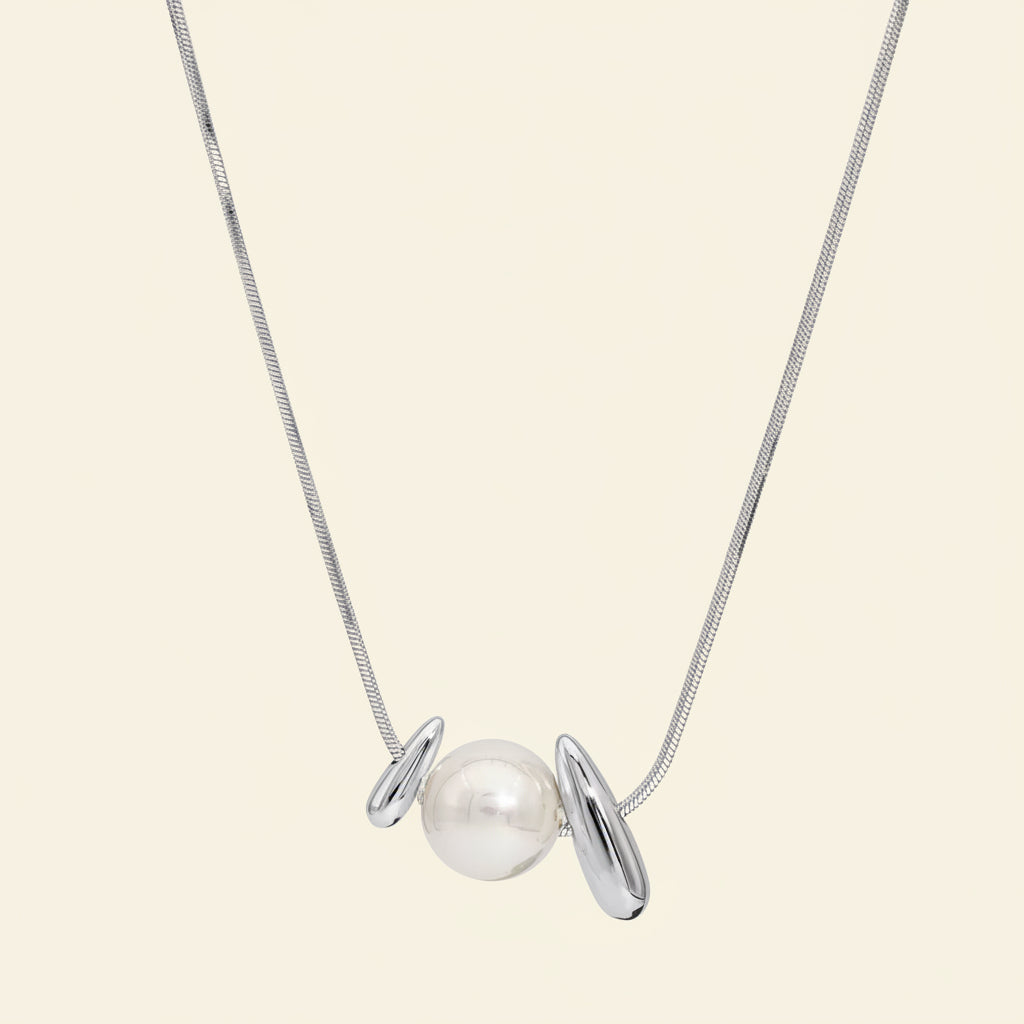 Necklace with a pearl pendant on a white background