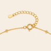 Gold clasp on a light beige background