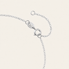 Silver bracelet on a light beige background