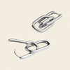  metallic hooks on a beige background