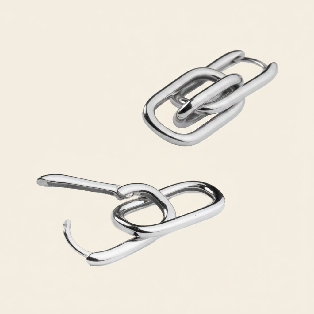  metallic hooks on a beige background