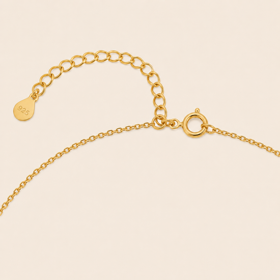 Gold Clasp on a beige background