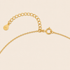 Gold Clasp on a beige background