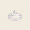 Silver ring with small stones on a light beige background