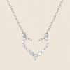 Silver necklace with a heart-shaped pendant on a beige background
