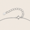 Silver chain Clasp on a light beige background