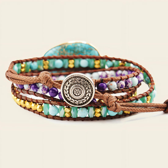 Multistrand beaded bracelet with a decorative button clasp on a beige background