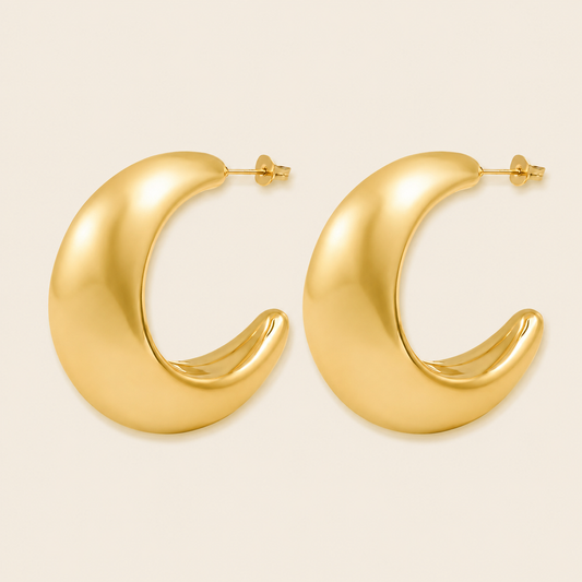Crescent Sweep Earrings with broad polished crescent-shaped hoops in gold finish