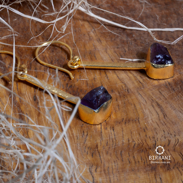 Handmade 18k gold-plated earrings featuring natural Amethyst stones, with a unique design, perfect for adding elegance to any look.