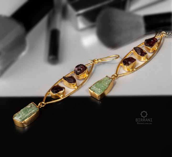 Elegant handmade earrings with 18k gold plating, featuring garnet and green aventurine stones, perfect for adding a touch of luxury to any outfit.