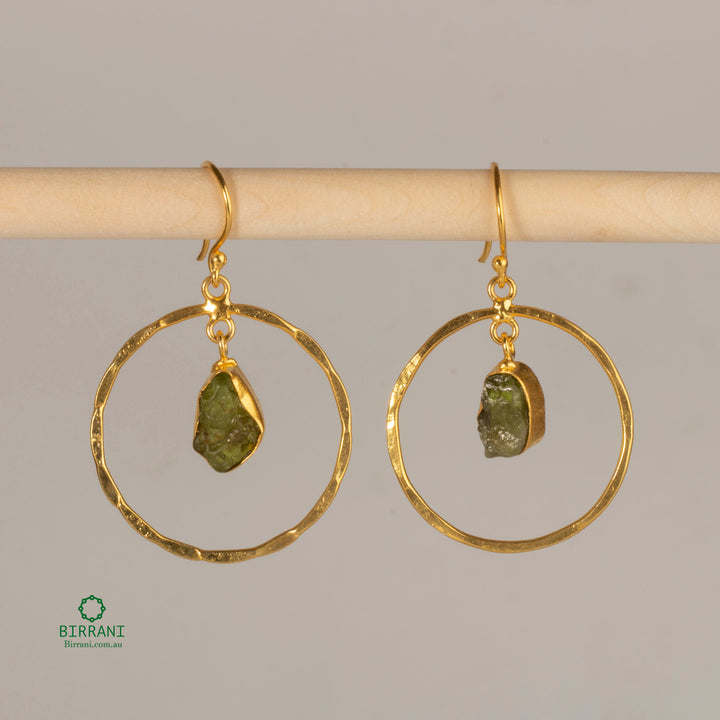 Handmade 18k gold-plated earrings featuring natural green aventurine stones set in hammered gold hoops, offering an elegant and earthy look.