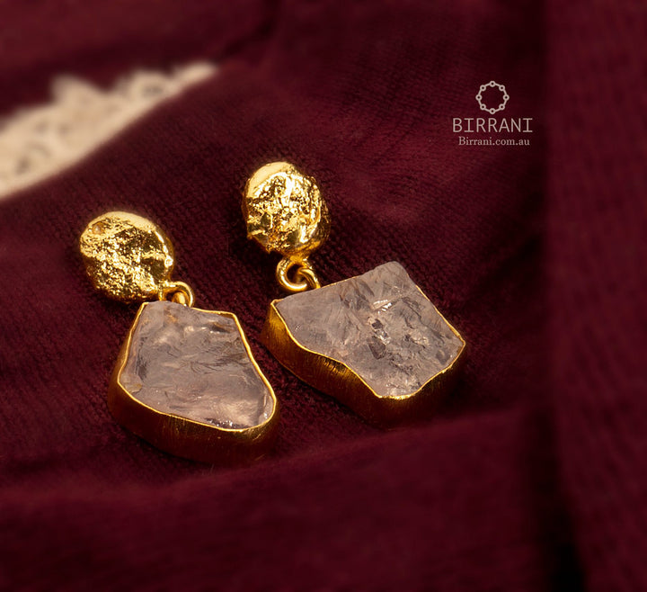 Elegant 18k gold-plated earrings featuring Rose Quartz natural stones with a unique shape, perfect for a refined, stylish look.