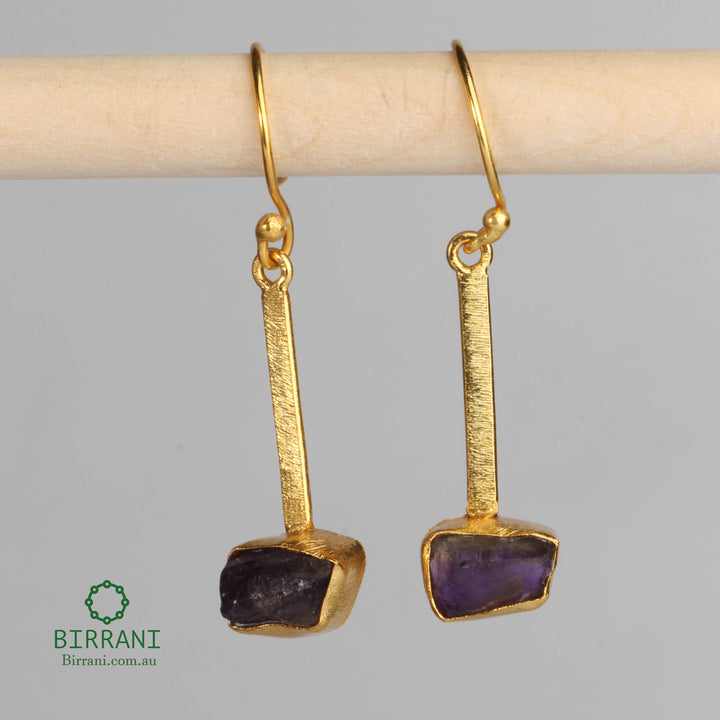 Handmade 18k gold-plated earrings featuring natural Sapphire stones, offering a sleek and elegant design, perfect for enhancing any outfit.