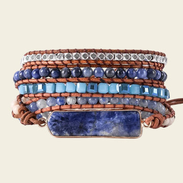 Handmade adjustable 5-layer bracelet with Sodalite natural stone, blue beads, and leather for a boho chic style.