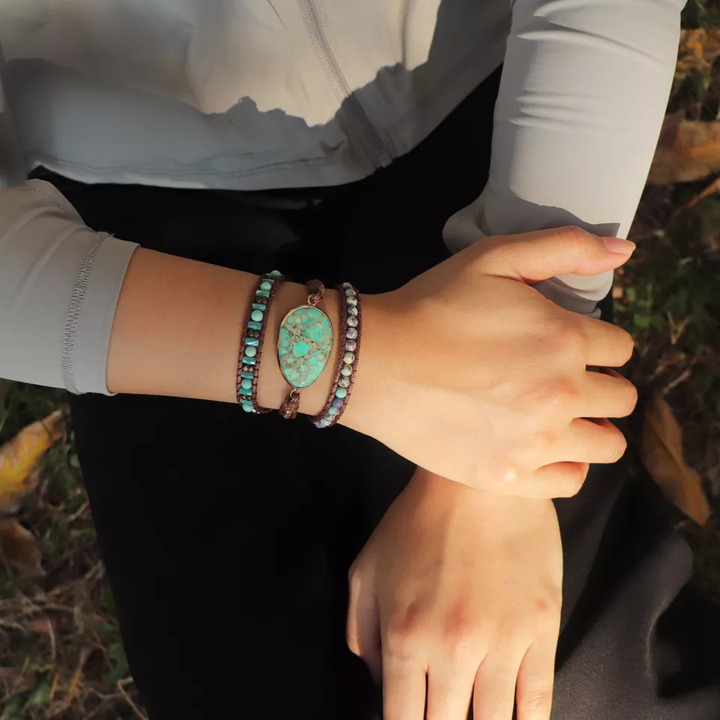 Handmade adjustable bracelet featuring turquoise natural stone beads, with a unique centerpiece stone, perfect for casual and boho-style outfits.
