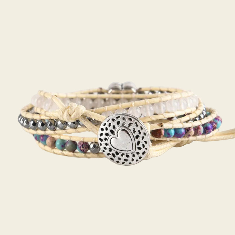 Adjustable handmade bracelet featuring natural stones like rose quartz, purple turquoise, and hematite, with a heart charm engraved with "Mom" – an ideal gift for Mother's Day.