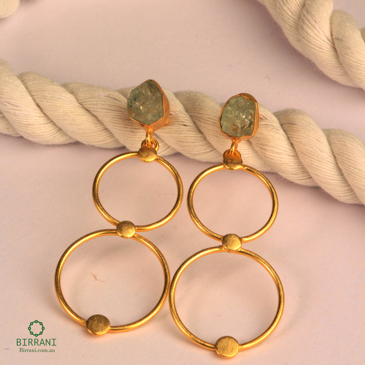 Elegant handmade 18k gold plated earrings featuring natural aquamarine stones, perfect for a unique and stylish addition to any jewellery collection.