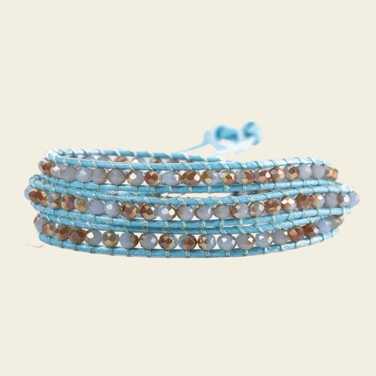 Handmade 3-layer blue leather wrap bracelet with light gray and bronze faceted crystal beads, adjustable closure.