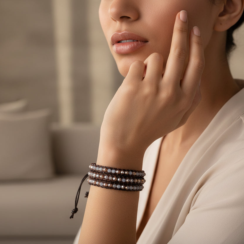 Handmade 3-layer brown leather wrap bracelet with light gray and bronze faceted crystal beads, adjustable closure.