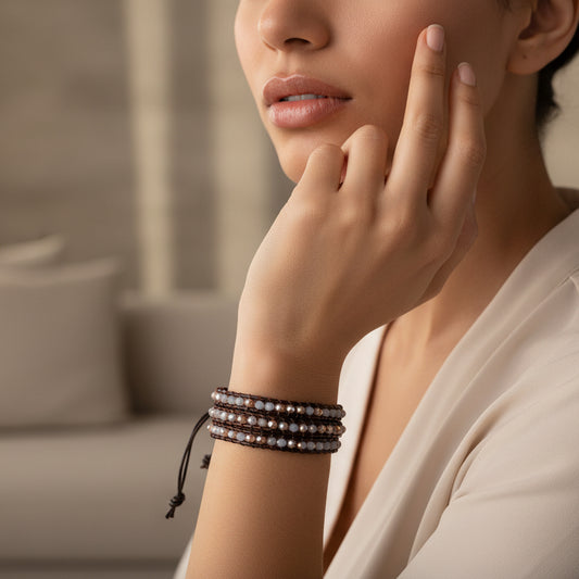 Handmade 3-layer brown leather wrap bracelet with light gray and bronze faceted crystal beads, adjustable closure.