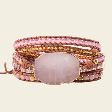 Adjustable handmade 5-layer Rose Quartz bracelet with pink beads, gold accents, and leather cord, perfect for a chic and elegant accessory.