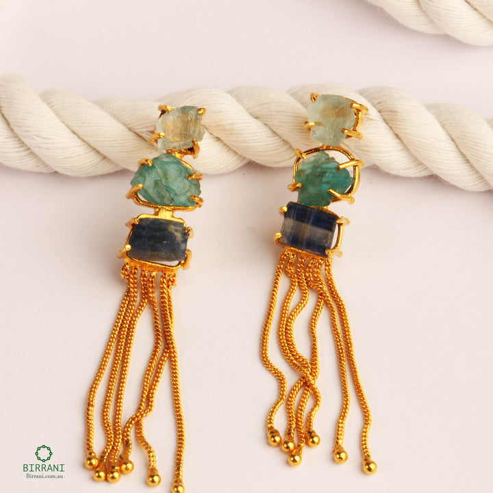 Elegant handmade gold-plated earrings featuring Aquamarine, Apatite, and Blue Kyanite natural stones with cascading gold tassels, perfect for adding a touch of sophistication.