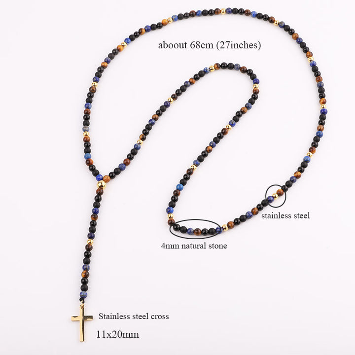 Handmade necklace featuring black and blue beads with stainless steel accents and a gold cross pendant.