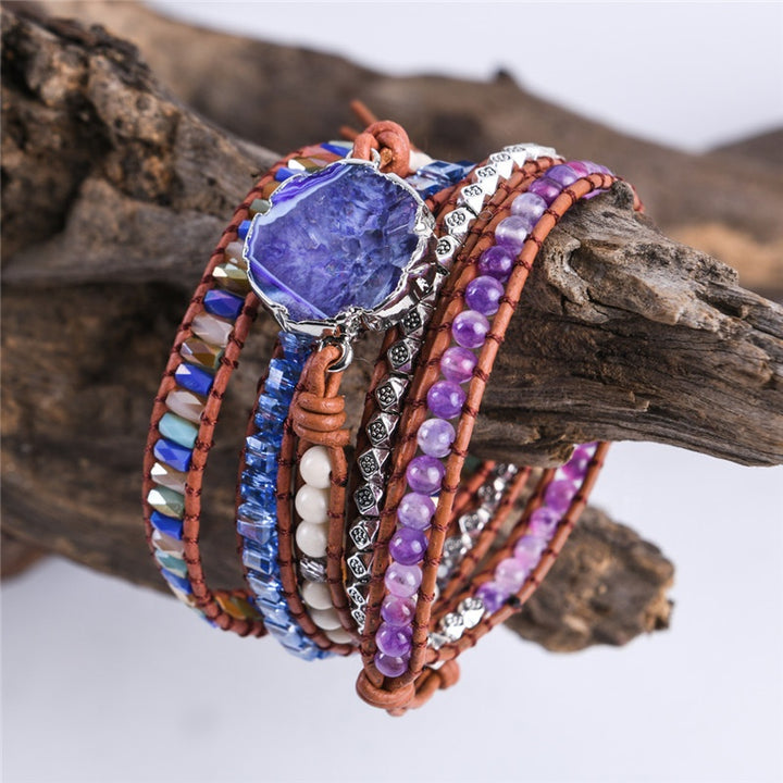 Handmade adjustable 5-layer bracelet with a striking grape agate slice centerpiece, complemented by multi-colored beads and silver accents, perfect for adding a boho touch to any outfit.
