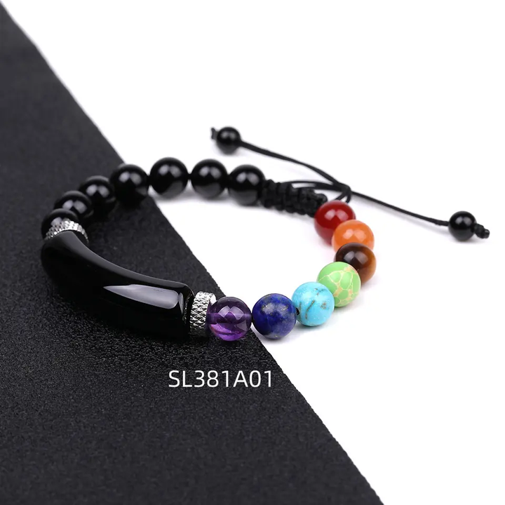 Handmade adjustable beaded bracelet featuring a curved black stone, multicolor gemstone beads, and stainless steel accents, designed with a black woven cord.