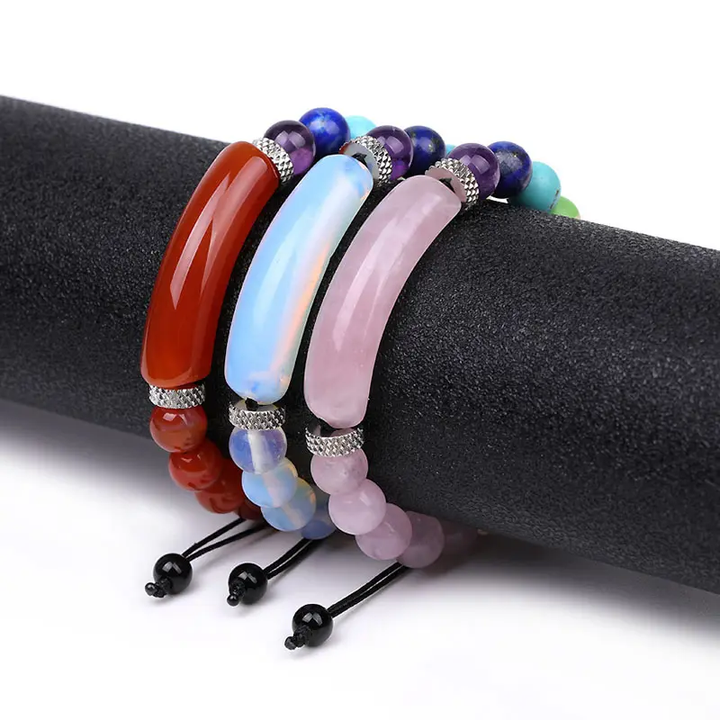 Set of handmade adjustable bracelets featuring natural Carnelian, Opalite, and Rose Quartz beads with silver-toned accents, displayed on a black cushion.

SEO-Friendly File Name: