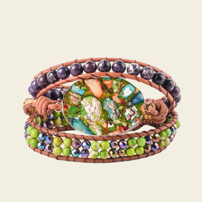 Handmade adjustable 3-layer wrap bracelet featuring vibrant Rainforest Jasper stones, purple beads, and green crystal accents, perfect for boho-style enthusiasts.
