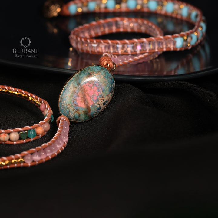 Handmade adjustable bracelet featuring a vibrant Ruby In Kyanite stone with natural beads and metallic accents, ideal for a boho-inspired look.