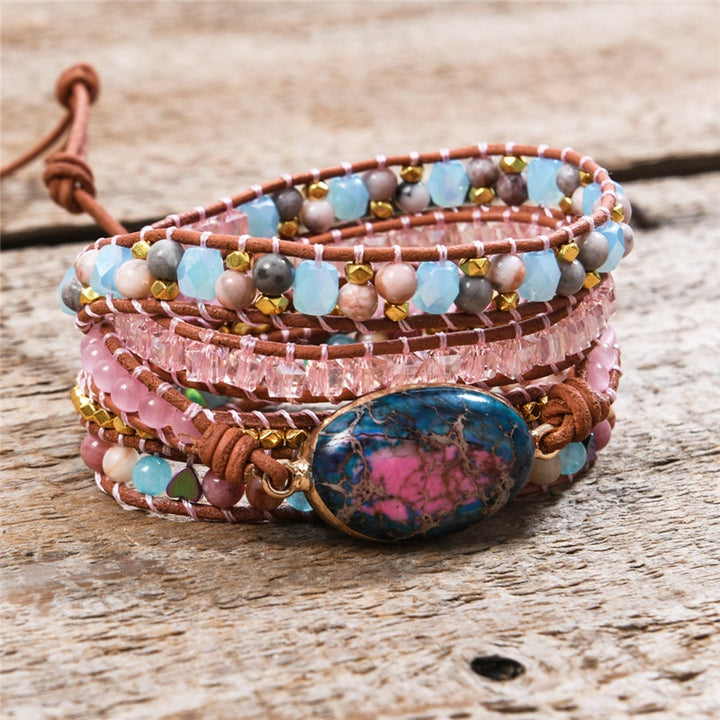 Handmade adjustable bracelet featuring Ruby In Kyanite stone with natural beads and metallic accents, perfect for adding a boho touch to any outfit.