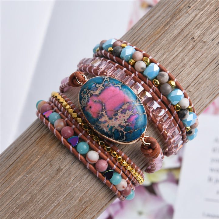 Handmade adjustable bracelet with a vibrant Ruby In Kyanite stone and natural beads, including turquoise and metallic accents, perfect for a boho-inspired style.