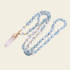 Handmade necklace featuring aquamarine and clear quartz beads, with a stunning quartz crystal pendant, accented with gold details for a chic boho style.