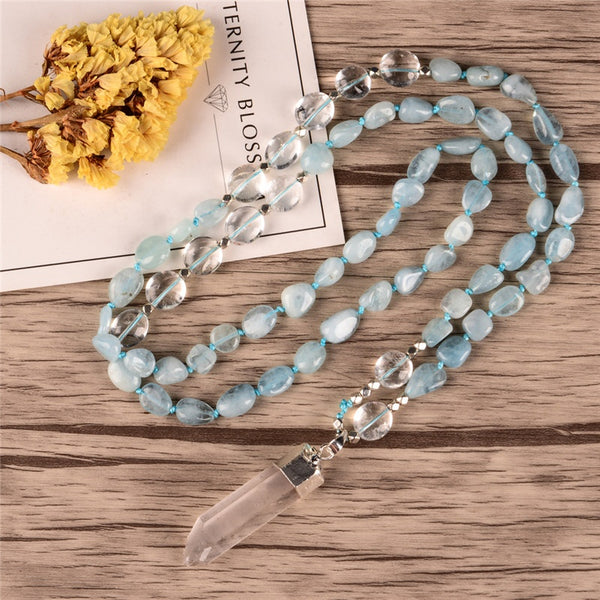 Handmade necklace with a natural aquamarine crystal pendant, accented with clear quartz and aquamarine beads, offering a calming and healing energy. Perfect for spiritual growth and adding a tranquil touch to your outfit.