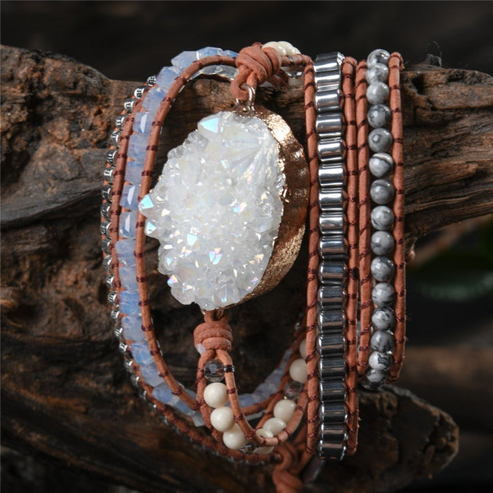 Five-layer handmade bracelet featuring a large clear quartz druzy stone centerpiece with metallic accents, set on brown leather for a stylish and unique look.